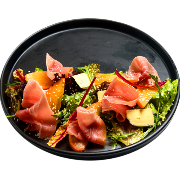 Salad with persimmon and prosciutto